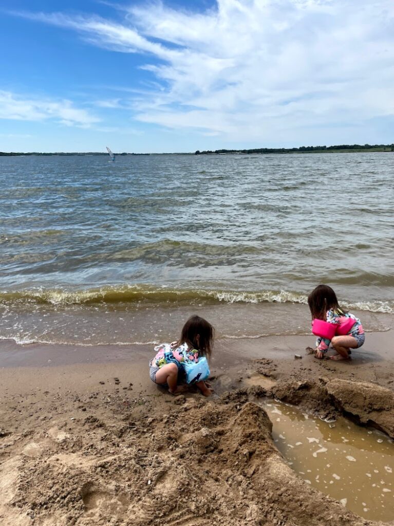 Kids playing in the sand at Smithville Lake, Missouri 