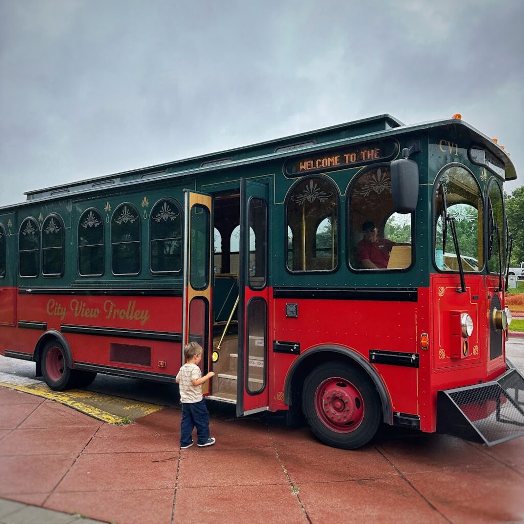 a boy stepping on a trolley in Rapid City, South Dakota 