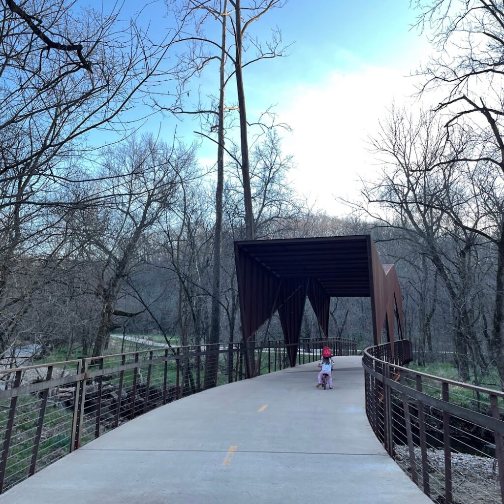 Girls biking in Coler Mountain Bike Preserve in Bentonville, Kansas City Weekend Getaways