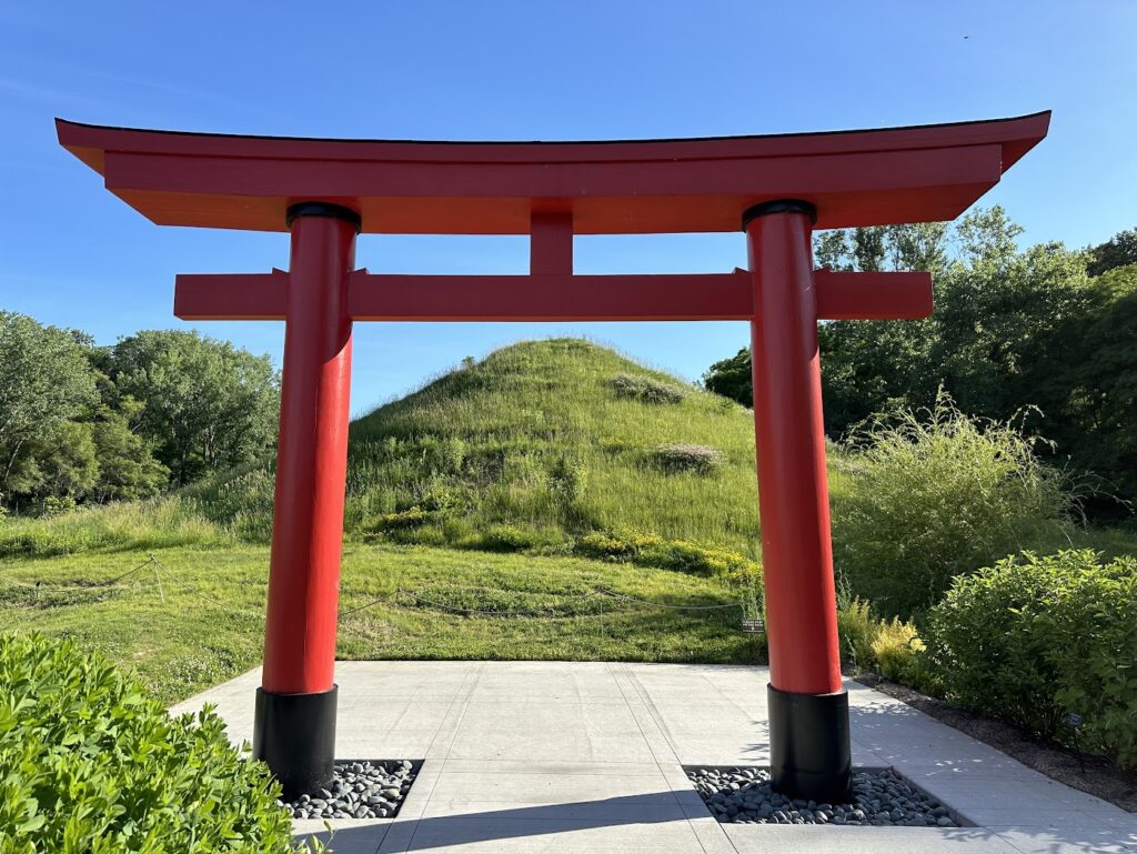 A red pagoda in front of a large hill at Lauritzen Gardens in Omaha. road trips from Kansas City