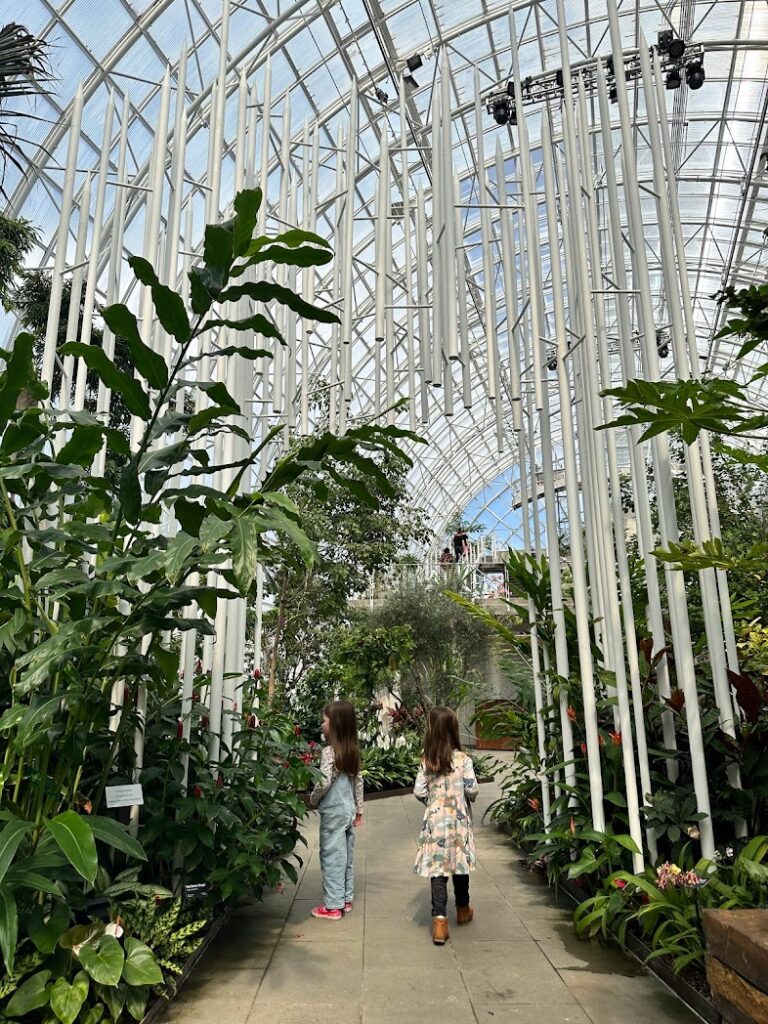 Two girls walking down a path in Myriad Gardens in downtown Oklahoma City in road trips from Kansas City 