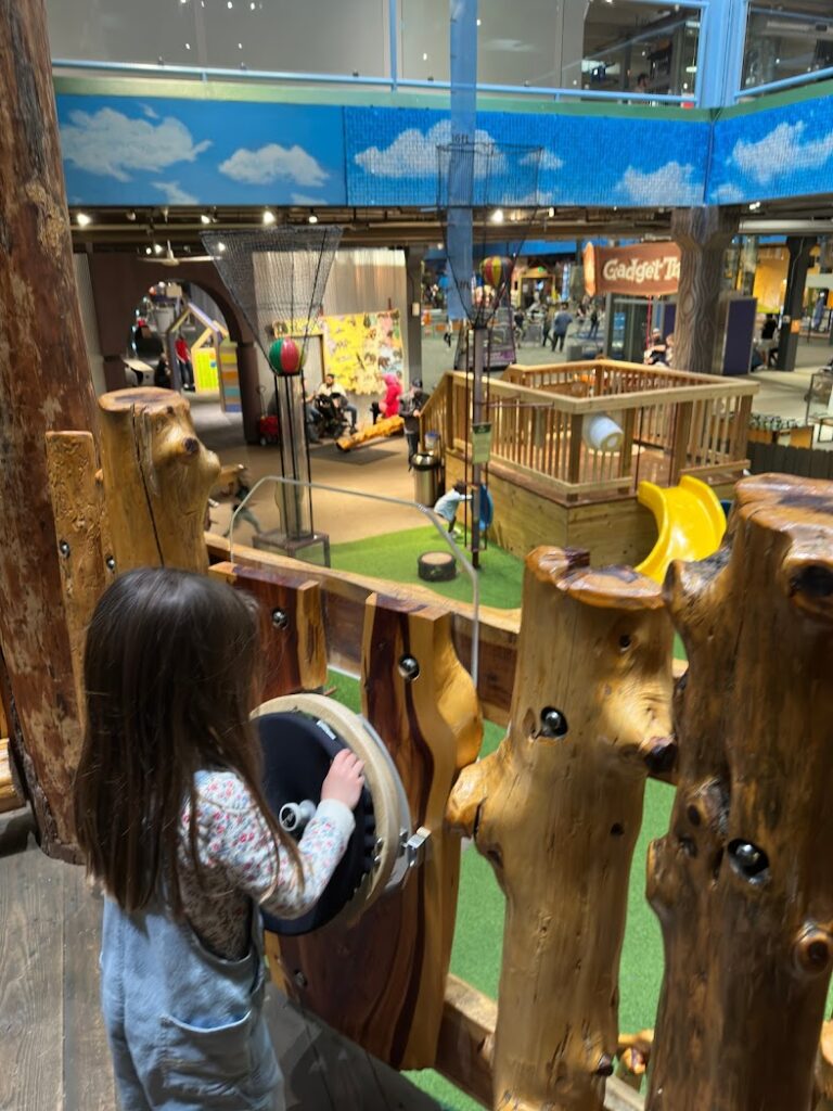 A girl playing at the Science Center of Oklahoma in Oklahoma City is a great stop for a road trip from Kansas City