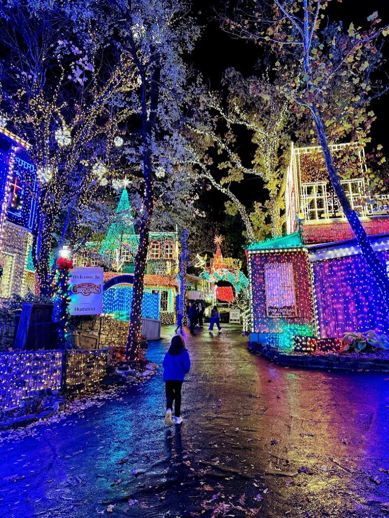 A girl walking through the Lights at Silver Dollar City for Christmas in Branson